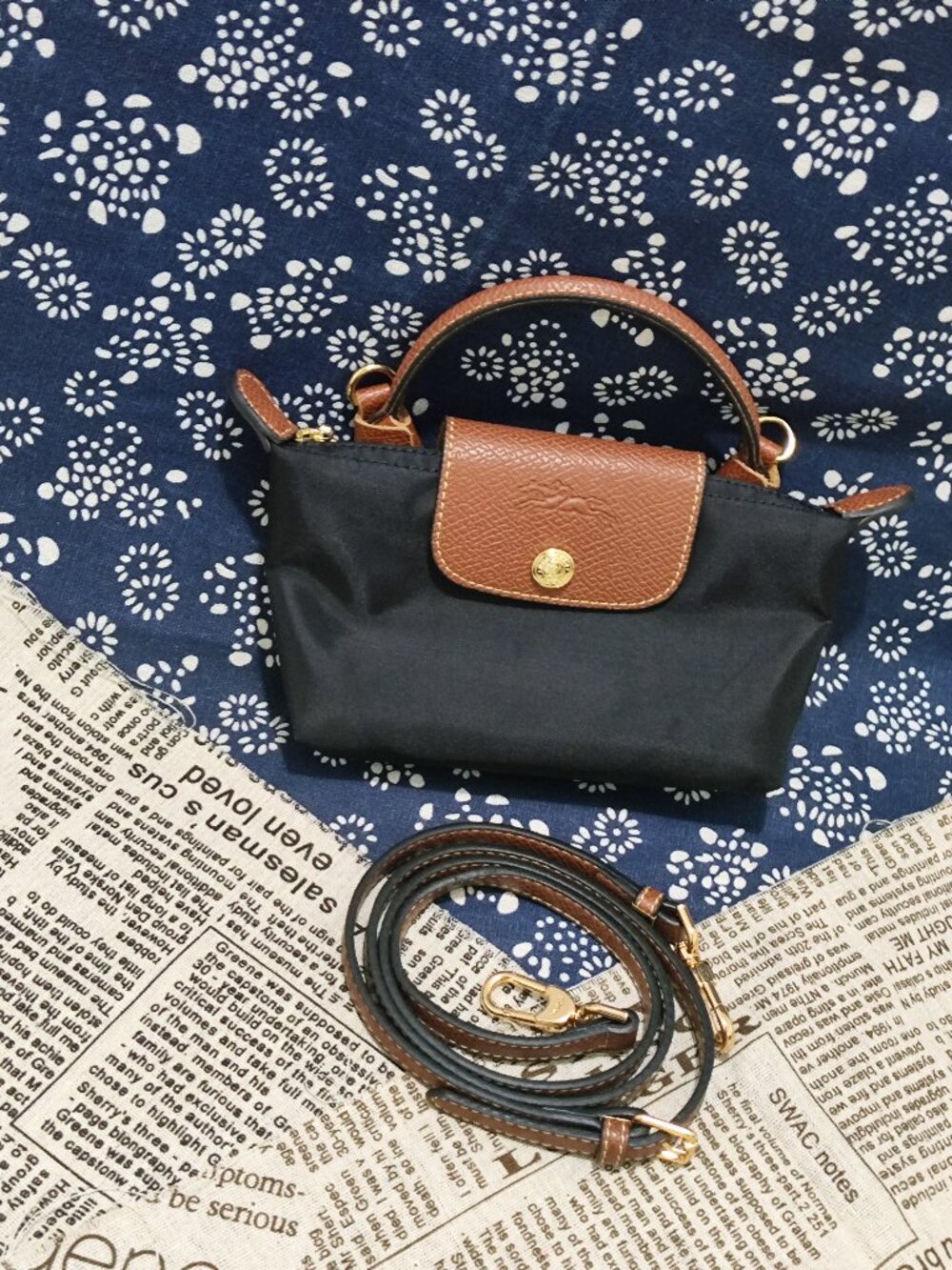 Longchamp mini dumpling bag in black and brown, multi-way casual women's bag.